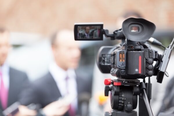 Filming an media event with a video camera